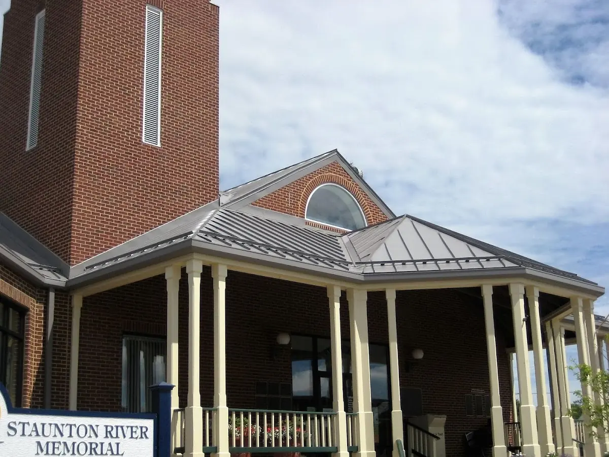 Skilled roofing craftsmen working on a residential roof in Caesars Head
